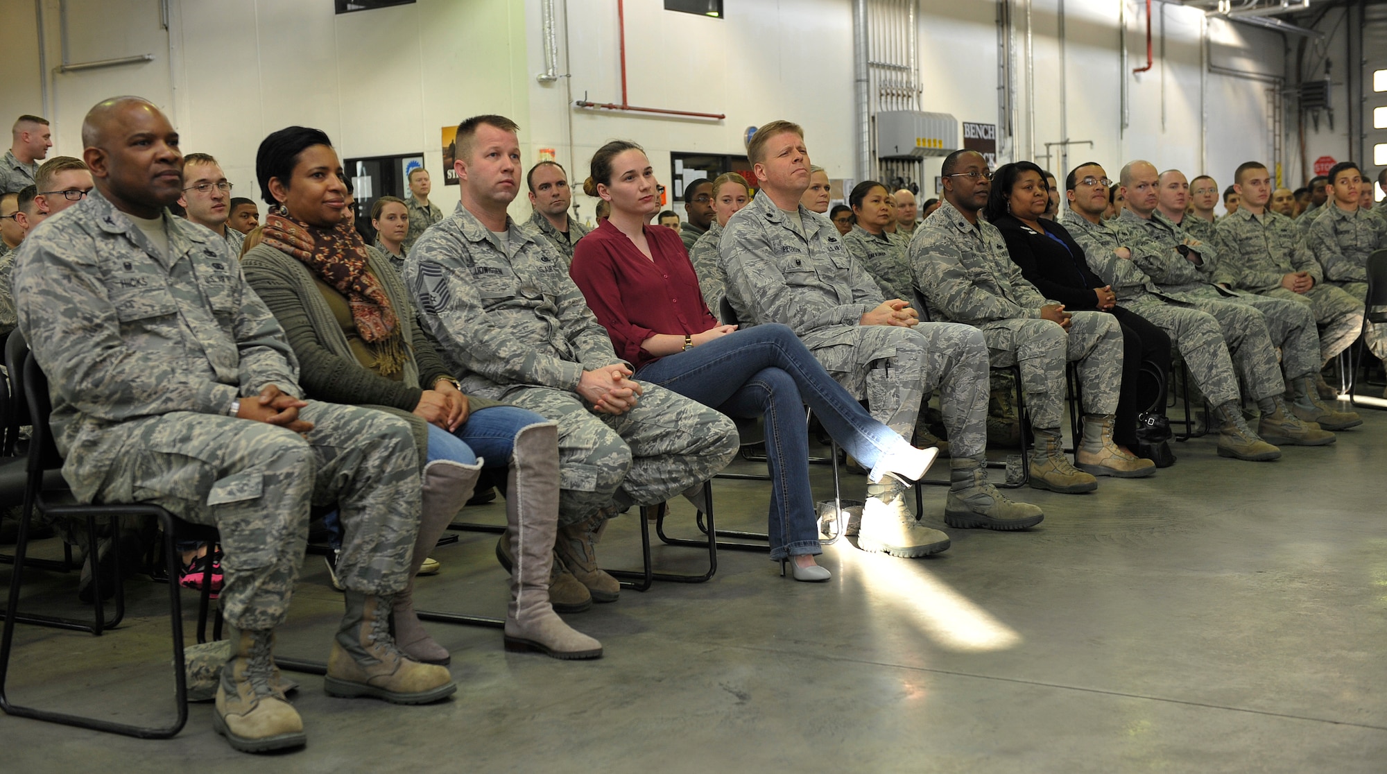 86th Airlift Wing leaders, their families and Airmen watch as families receive awards during a Homefront Heroes ceremony Feb. 19, 2016, at Ramstein Air Base, Germany. The event is the first of its kind on Ramstein and was hosted by the 86th Logistics Readiness Group. (U.S. Air Force photo/Airman 1st Class Larissa Greatwood) 