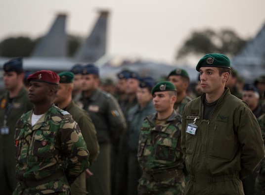 Allied service members wait for the opening ceremony to begin for exercise Real Thaw to begin Feb. 21, 2016, in Beja, Portugal. Real Thaw 16 is a Portuguese- hosted NATO exercise that provides tactical training to multiple participating nations. Its aim is to merge and employ different aerial platforms towards one major objective, covering a vast range of activities to include Defensive and Offensive Counter Air Operations, High Value Air Assets Protection and a Slow Mover Protection. Nations participating this year include the U.S., Portugal, Belgium, Denmark, France, Netherlands, Norway and Spain. (U.S. Air Force photo/Senior Airman Jonathan Stefanko)