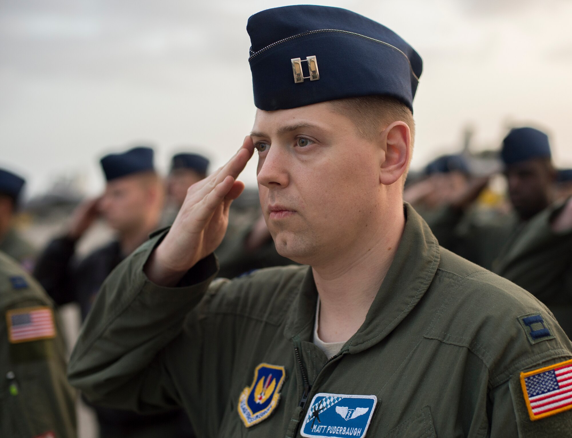 Capt. Matt Puderbaugh, 37th Airlift Squadron flight surgeon, salutes during the opening ceremony of exercise Real Thaw 16 in Beja, Portugal, Feb. 21. Real Thaw 16 is a Portuguese hosted NATO exercise that provides tactical training to multiple participating nations. Its aim is to merge and employ different aerial platforms towards one major objective, covering a vast range of activities to include Defensive and Offensive Counter Air Operations, High Value Air Assets Protection and a Slow Mover Protection. Nations participating this year include the U.S., Portugal, Belgium, Denmark, France, Netherlands, Norway and Spain. (U.S. Air Force photo/Senior Airman Jonathan Stefanko)