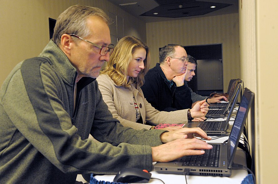 Members of the Kaiserslautern Military Community take the Military Saves pledge to build wealth, not debt during the kickoff event for Military Saves Week Feb. 19, 2016, at Ramstein Air Base, Germany. By taking the pledge, service members, Department of Defense civilians and their family members became eligible for a free credit report. The theme for the 2016 Military Saves Week is “Make Saving Automatic.” (U.S. Air Force photo/Staff Sgt. Timothy Moore)