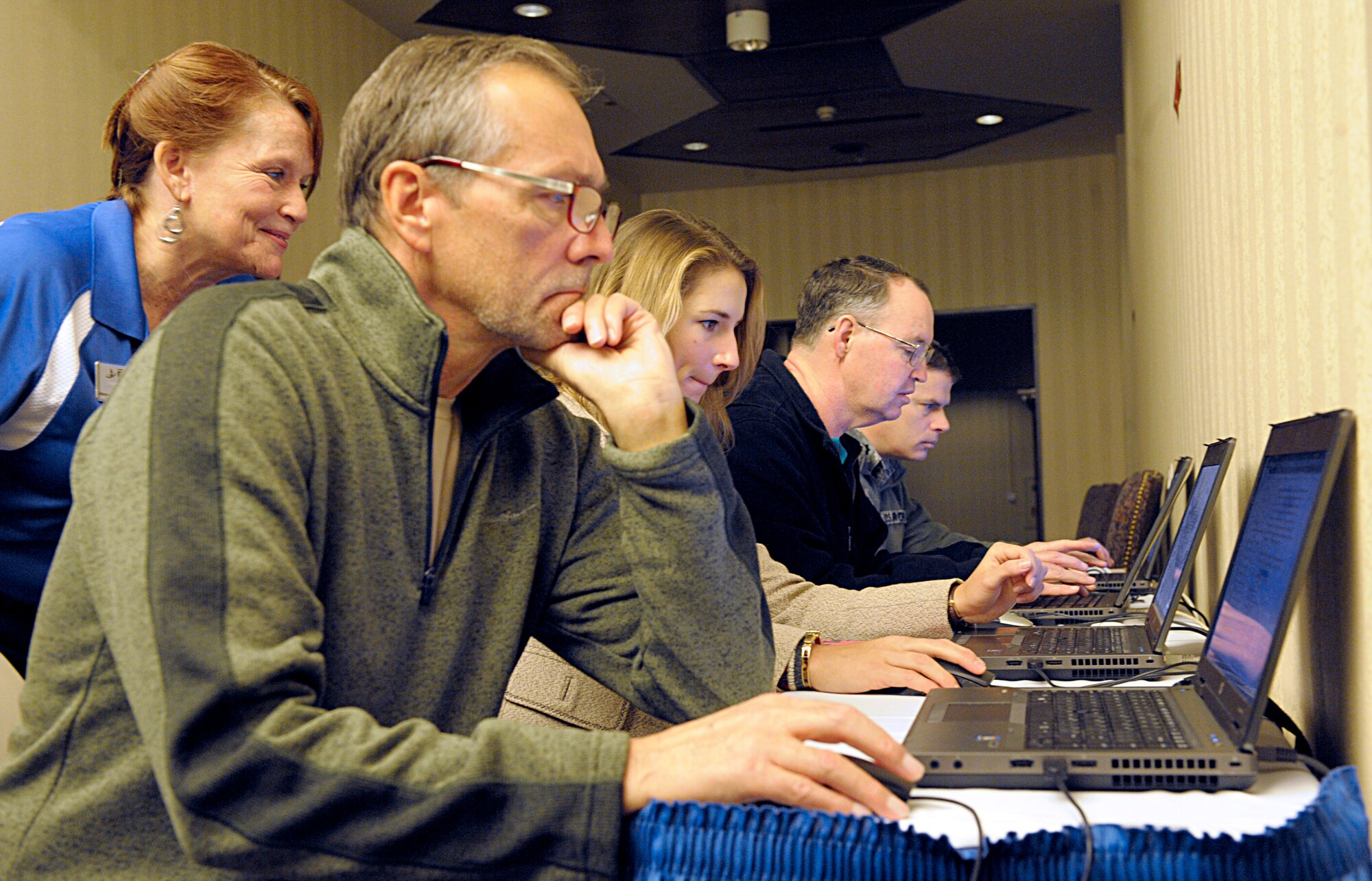 Members of the Kaiserslautern Military Community take the Military Saves pledge to build wealth, not debt during the kickoff event for Military Saves Week Feb. 19, 2016, at Ramstein Air Base, Germany. By taking the pledge, service members, Department of Defense civilians and their family members became eligible for a free credit report. The theme for the 2016 Military Saves Week is “Make Saving Automatic.” (U.S. Air Force photo/Staff Sgt. Timothy Moore)
