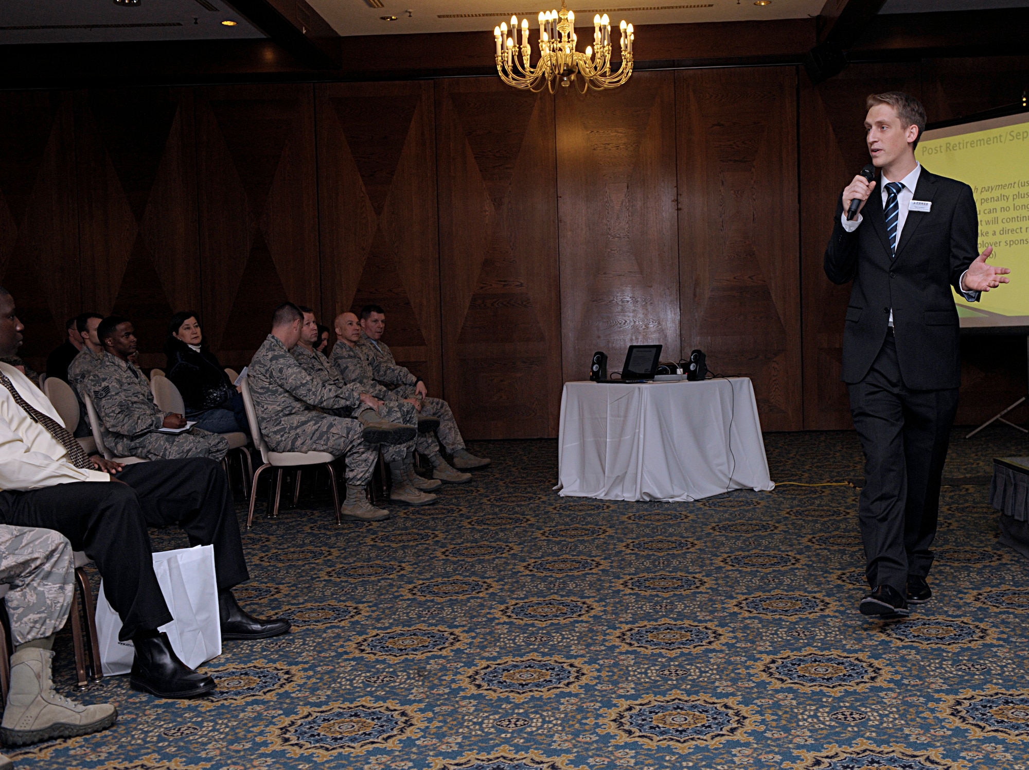 Kyle Lambert, 86th Force Support Squadron Airman and Family Readiness Center community support coordinator, speaks during the Military Saves Week kickoff Feb. 19, 2016, at Ramstein Air Base, Germany. The crowd consisted of members from the Kaiserslautern Military Community, who can all take advantage of classes and personal financial counselors made available during the week. The theme for the 2016 Military Saves Week is “Make Saving Automatic.” (U.S. Air Force photo/Staff Sgt. Timothy Moore)