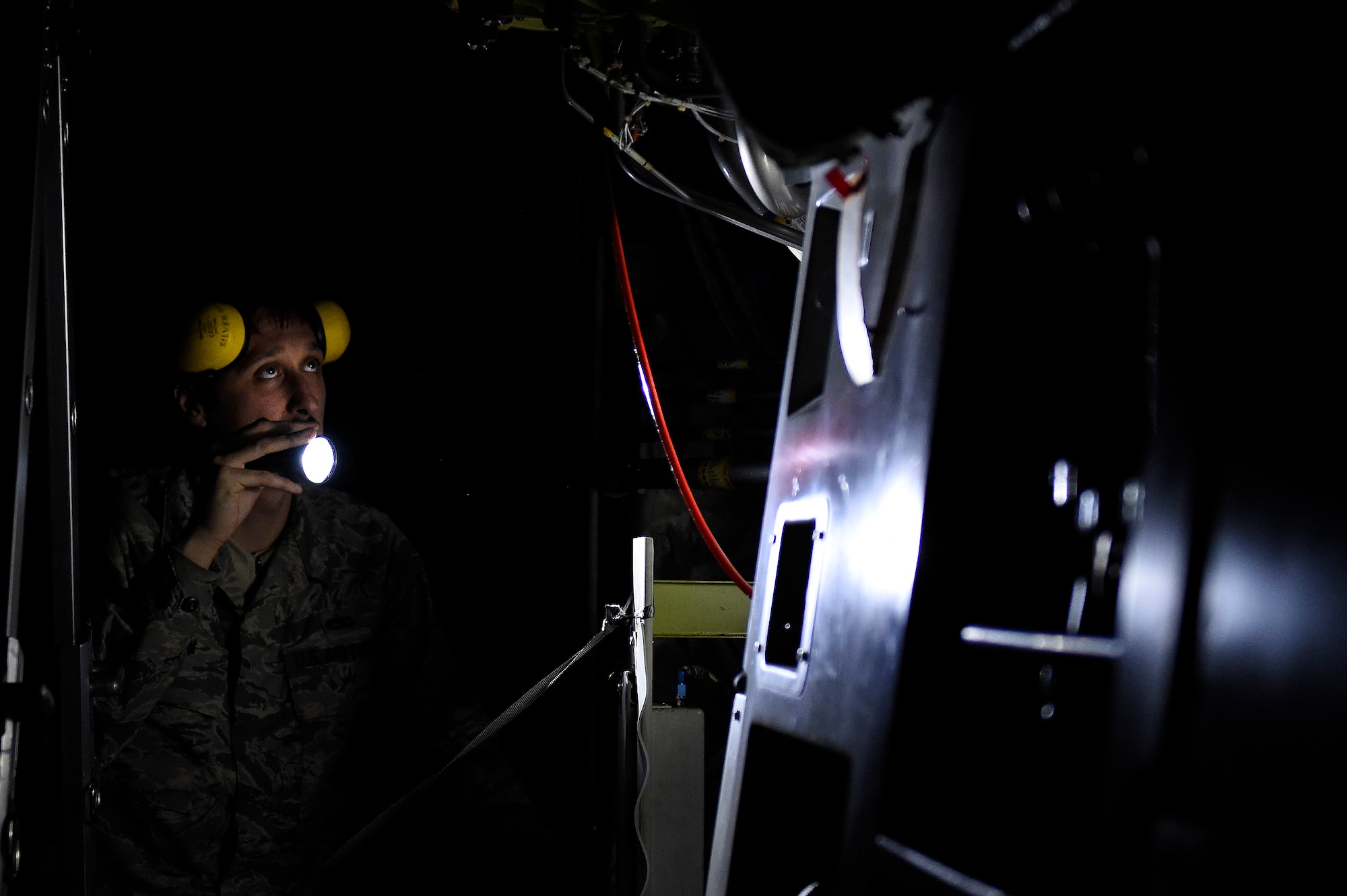 Staff Sgt. Nathan Kuhn, 62nd Maintenance Squadron hydraulics systems craftsman, inspects a broken hydraulic reservoir Feb. 18, 2016 at North Island Naval Station, Calif. Kuhn was the team lead of a four person McChord Maintenance Recovery Team sent from Joint Base Lewis-McChord, Wash., to repair a C-17 Globemaster III. (U.S. Air Force photo/Tech Sgt. Tim Chacon)