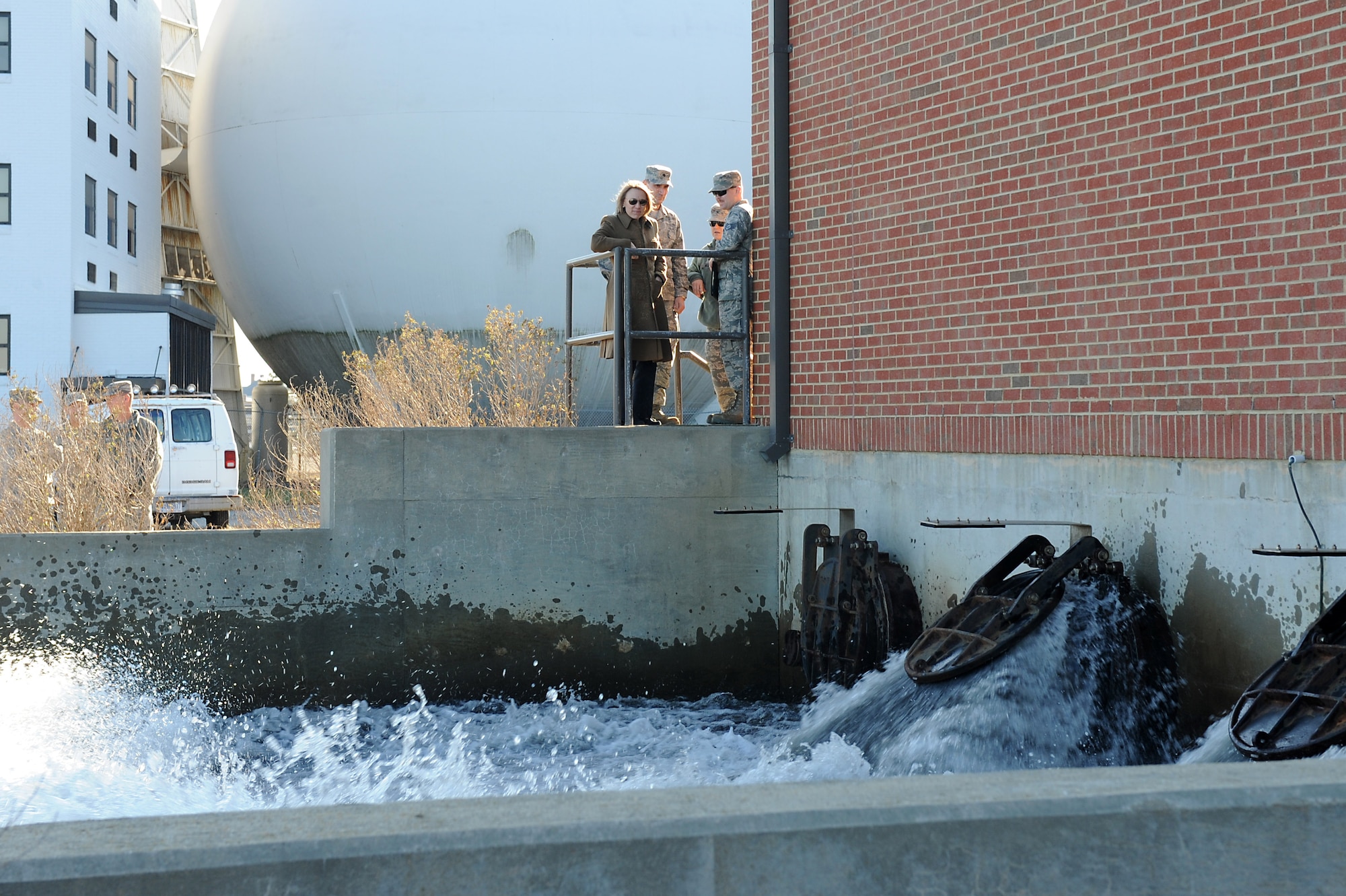 U.S. Air Force Staff Sgt. Ronald Owen, 633rd Civil Engineer Squadron water and fuels systems maintenance craftsman, demonstrates the capabilities of the storm pump house to the Honorable Miranda Ballentine, Assistant Secretary of the Air Force for Installations, Environment and Energy, at Langley Air Force Base, Va., Feb. 18, 2016. Ballentine’s visit focused on the support for ongoing energy programs such as Office of Energy Assurance, resilient energy demonstrative initiatives, and operational energy initiatives. (U.S. Air Force photo by Senior Airman Brittany E. N. Murphy)