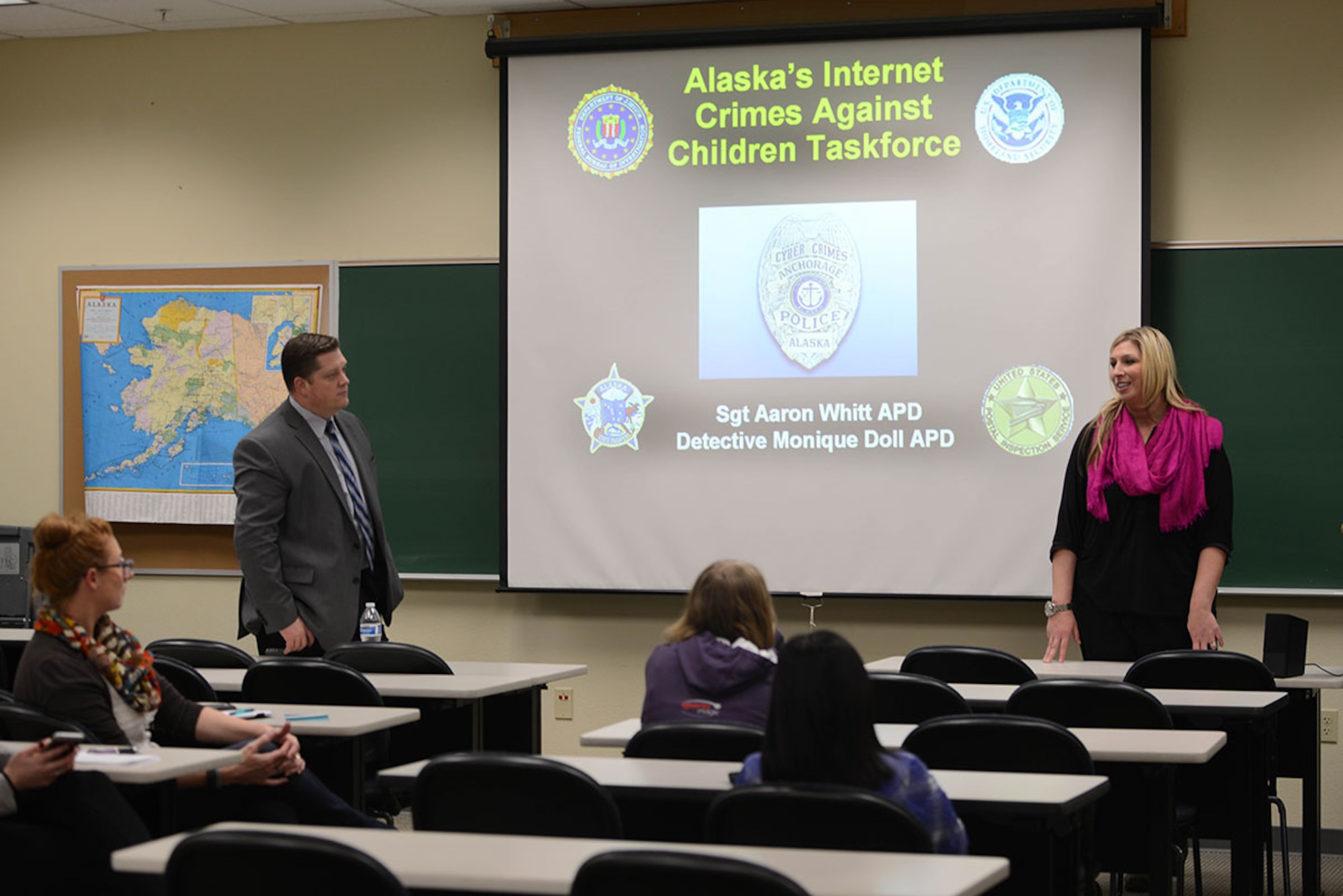 Alaska Police Department Sgt. Aaron Whitt, left, and Detective Monique Doll, give a presentation during an internet safety class for teens and parents at the Joint Base Elmendorf-Richardson Education Center, Feb. 19. The class provided parents and other interested individuals a look at current applications and social media that children and teens are using to socialize and interact. Both Whitt and Doll are part of the APD’s Alaska Internet Crimes Against Children Taskforce. (U.S Air Force photo by Airman 1st Class Javier Alvarez)