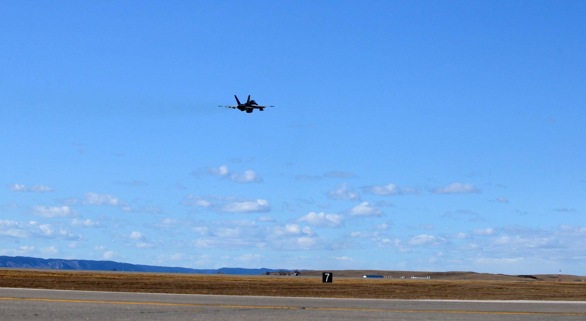 An F/A-18F Super Hornet takes off from Ellsworth Air Force Base, S.D., Feb. 19, 2016. Eleven Super Hornets from the Strike Fighter Squadron Three Two (VFA-32 Swordsmen) at Naval Air Station Oceana, Va., made an operational stop at Ellsworth on their way back to Virginia after completing a training exercise near NAS Fallon in Nevada. (U.S. Air Force photo by Tech. Sgt. R. Michael Longoria/Released)