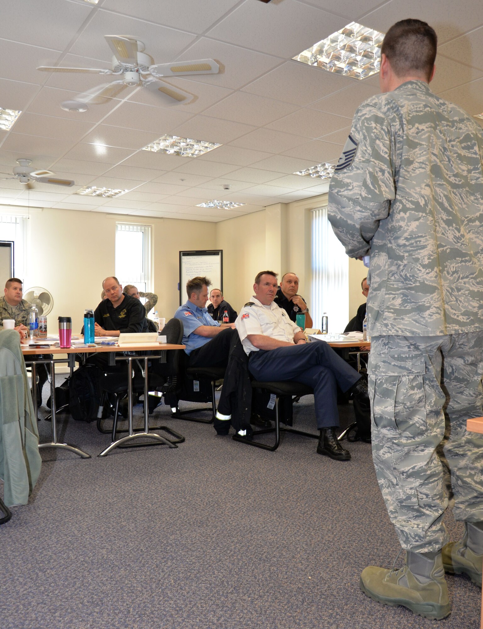 U.S. Air Force Master Sgt. Michael Wobser, 100th Civil Engineer Squadron Fire Department assistant chief of operations, goes through the results of a test during a National Incident Management System 300/400 course Feb. 18, 2016, on RAF Mildenhall, England. The course directors hoped that by bringing service members and civilians from a diverse background together, the wealth of knowledge shared would be extensive. (U.S. Air Force photo by Gina Randall/Released)