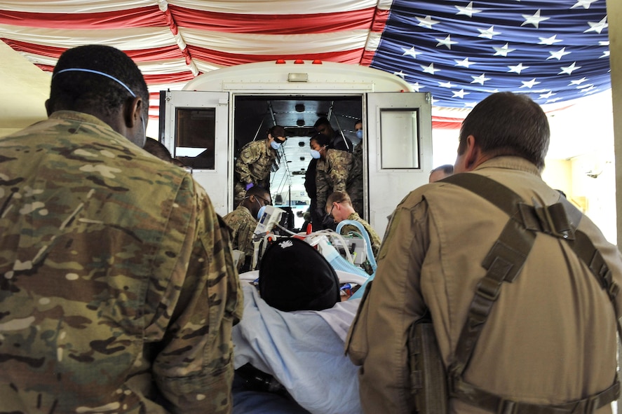 Airmen work with members of the Extracorporeal Membrane Oxygenation team to save the life of a NATO troop at the Craig Joint-Theater Hospital on Bagram Airfield, Afghanistan, Feb. 18, 2016. Air Force photo by Tech. Sgt. Nicholas Rau