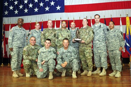 Sgt. 1st Class Michael Long holds an award recognizing him as the California Army National Guard's top recruiter for 2015, having enlisted 31 new, non-prior-service soldiers, Dec. 4 at Camp San Luis Obispo, Calif. Only a few weeks later, on Dec. 30, Long would jump into Markham Ravine near Lincoln to rescue a woman who was trapped in her sinking car. With the help of a retired Airman and a California Highway Patrol officer, Long was able to help the woman to safety. 