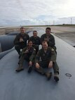 Capt. Bradley Stone, top left, and Senior Airman Samantha Strom, top middle, both assigned to the 932nd Aeromedical Evacuation Squadron at Scott Air Force Base, pose with fellow medical aircrew members while on a temporary assignment to Hawaii. Stone and Strom both rushed to aid survivors of a downed helicopter that crashed into Pearl Harbor, Feb. 18, 2016, Honolulu Hawaii. (Courtesy photo)
