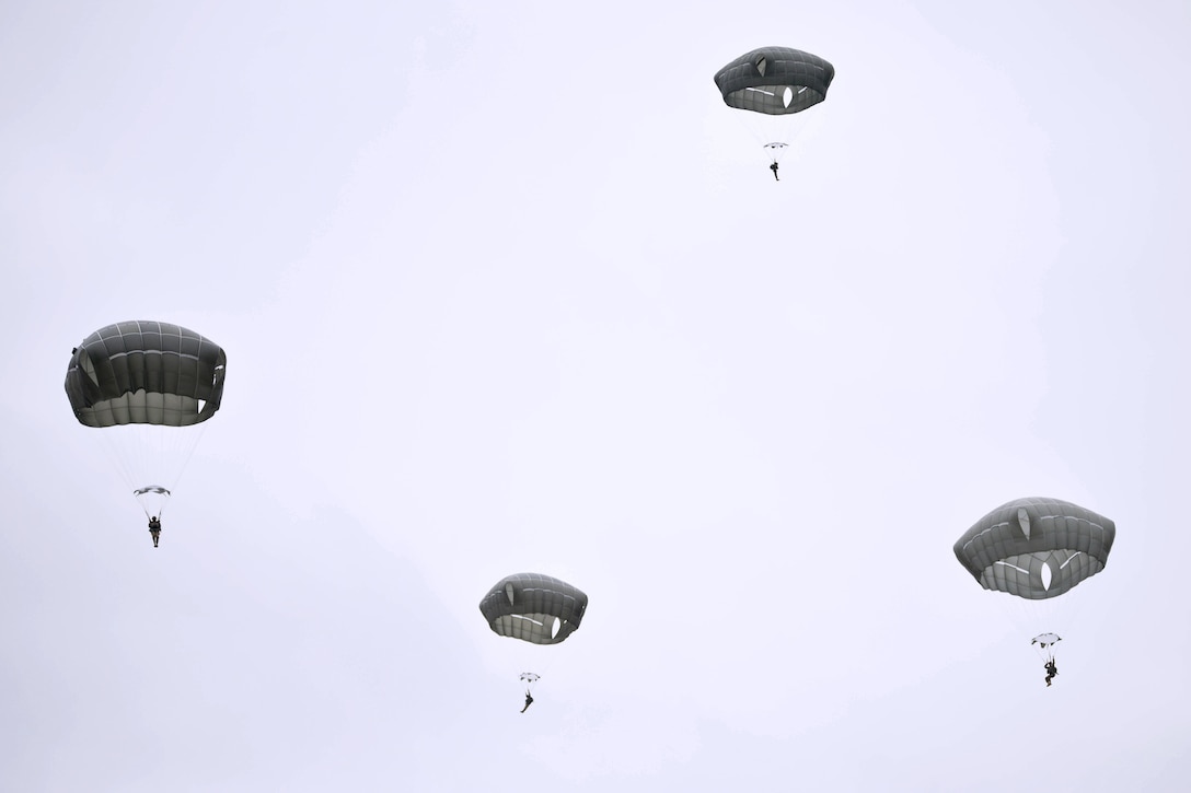 Paratroopers jump from a UH-60 Black Hawk helicopter over Grafenwoehr Training Area, Germany, Feb. 16, 2016. Army photo by Pvt. Javon Spence