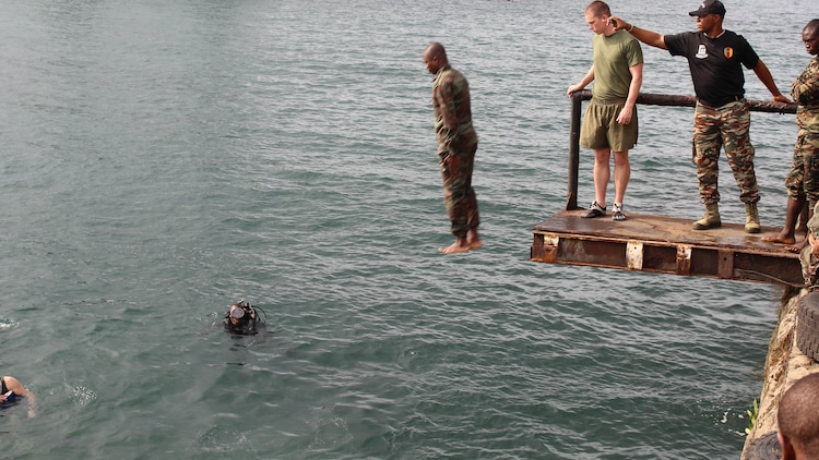 U.S. Marines and sailors are working with Cameroon’s Fusiliers Marins and Compagnie des Palmeurs de Combat to increase their capabilities to combat illicit activity and increase security in the waterways and borders of Cameroon. At the request of the Cameroonian government and through coordination with the U.S. Embassy in Yaounde, Marines and sailors with Special-Purpose Marine Air-Ground Task Force Crisis Response-Africa, are partnering with their military counterparts in infantry tactics in support of their maritime security force capabilities. 