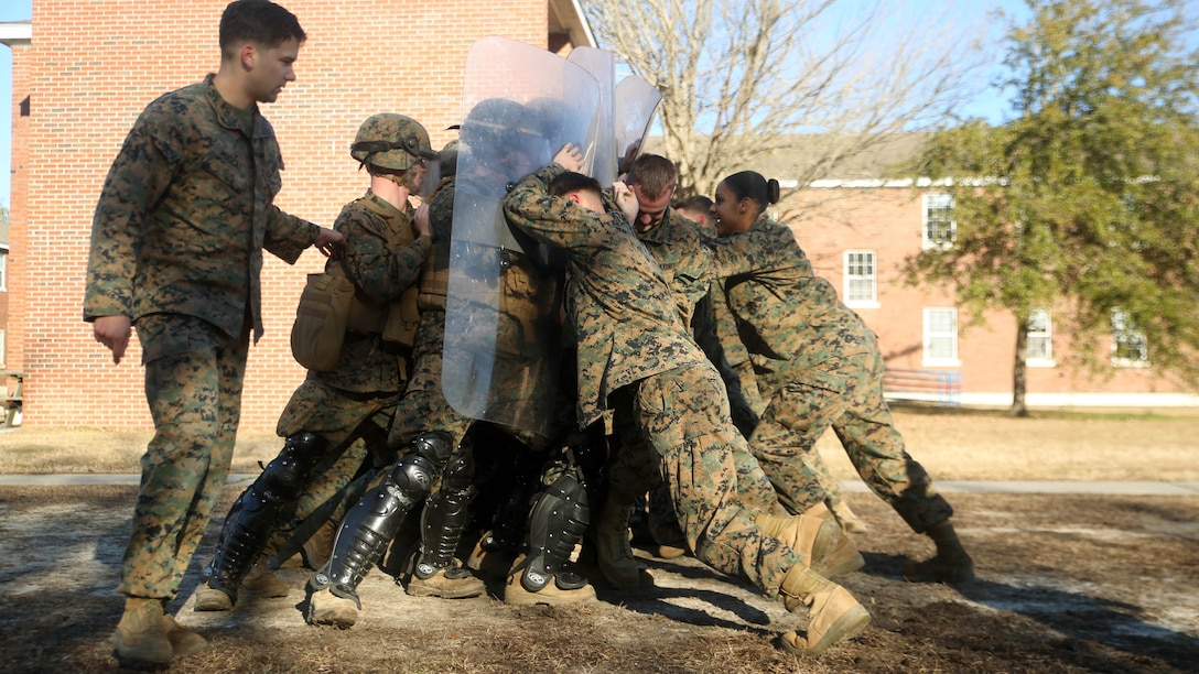 Marines with Combat Logistics Battalion 2 attempt to hold off a crowd during non-lethal riot control training at  Marine Corps Base Camp Lejeune, N.C., Feb. 19, 2016. The training is in preparation for the unit’s upcoming Special Purpose Marine Air-Ground Task Force-Crisis Response-Africa deployment later this year. 