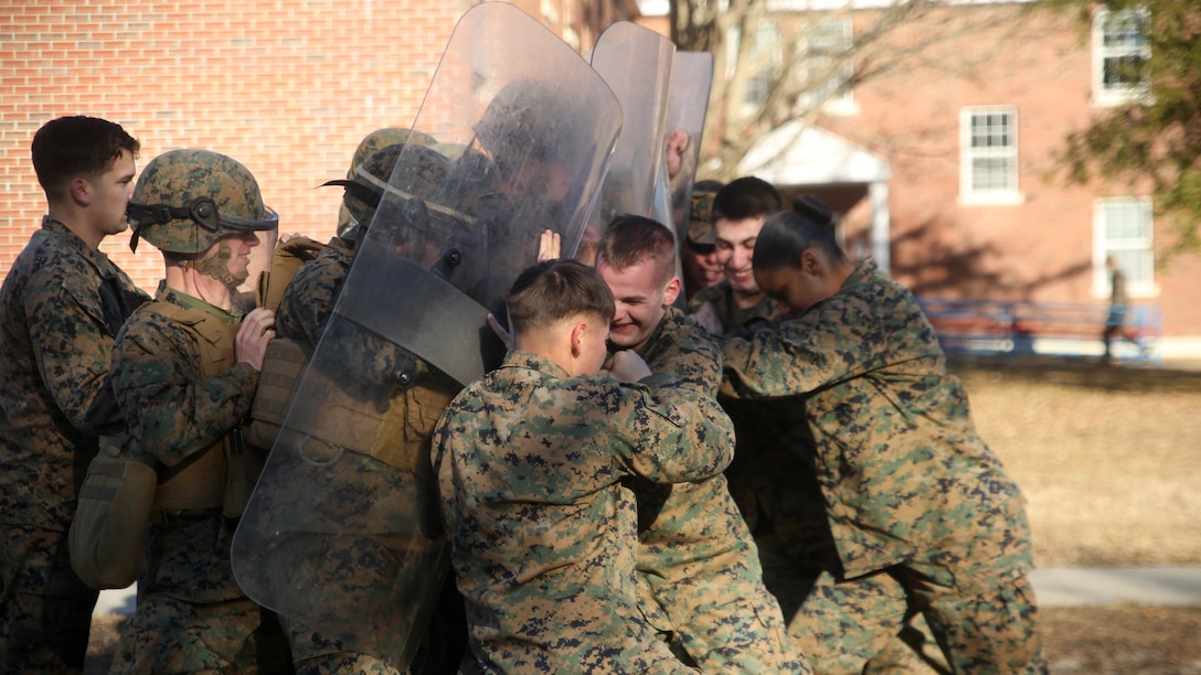 Marines with Combat Logistics Battalion 2 attempt to hold off a crowd during non-lethal riot control training at  Marine Corps Base Camp Lejeune, N.C., Feb. 19, 2016. The training is in preparation for the unit’s upcoming Special Purpose Marine Air-Ground Task Force-Crisis Response-Africa deployment later this year. 