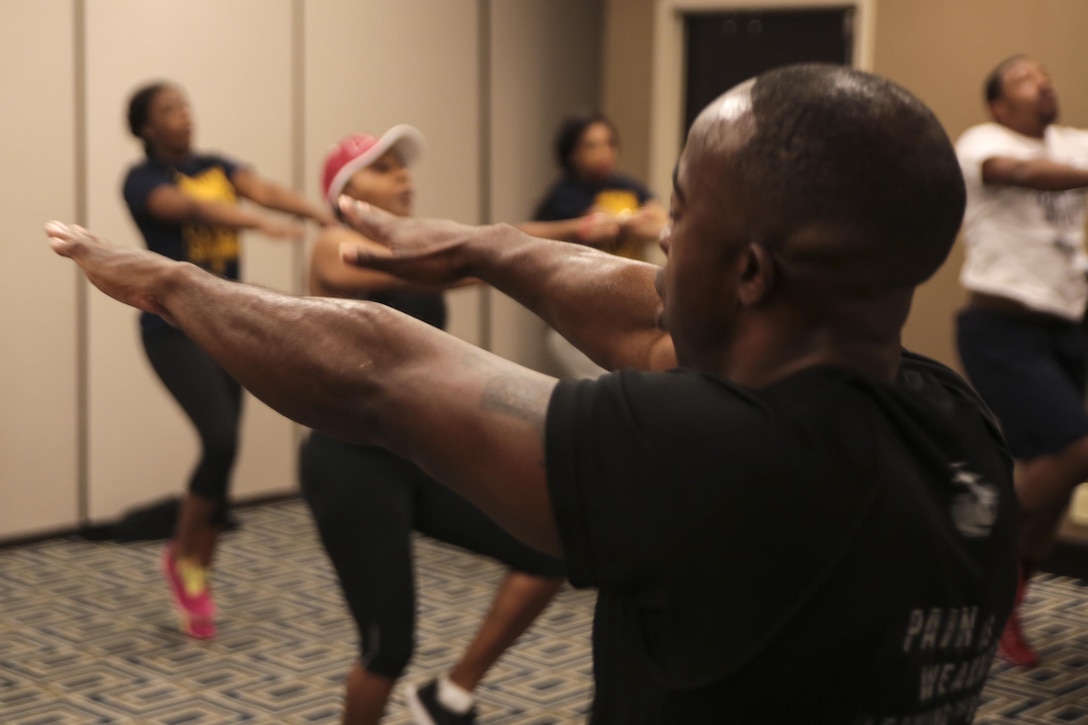 Gunnery Sgt. Michael Johnson, staff noncommissioned officer for Houma recruiting station, leads the Wake Up and Work Out event at Hyatt Regency Hotel in New Orleans La, Feb. 20, 2016. Wake Up and Work Out is part of the Empower Me Tour, a partnership between the Marine Corps and the United Negro College Fund to increase awareness among college and high school students to consider service in the Marine Corps as a career option. (U.S Marine Corps Photo by Cpl. Ian Ferro)