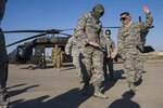 Airmen of the 386th Expeditionary Medical Group practice unloading a patient from a UH-60 Black Hawk helicopter at an undisclosed location in Southwest Asia on Feb. 18. The 386th EMDG trained with the 40th CAB to prepare for any medevac operation while deployed. 