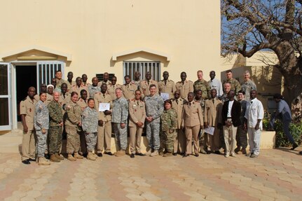 U.S. Army Reserve Soldiers from Medical Support Unit-Europe, 7th Mission Support Command, and both 399th and 345th Combat Support Hospitals, 3rd Medical Command Deployment Support, commemorate their partnership with their Senegalese counterparts with a group photo, in front of the Hopital Militaire de Ouakam, Dakar, Senegal, Jan. 29, 2016. The Soldiers are in partnership with the Senegalese Defense Force to conduct a U.S. Army Africa Medical Readiness Training Exercise, from Jan. 18-29. This exercise is the first of many scheduled throughout the year to demonstrate the strong partnership the U.S. has with its African partners. (U.S. Army photo by Capt. Charles An)