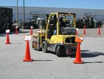 A participant in DLA Distribution Corpus Christi’s Forklift Rodeo navigates a course designed to test their skills.