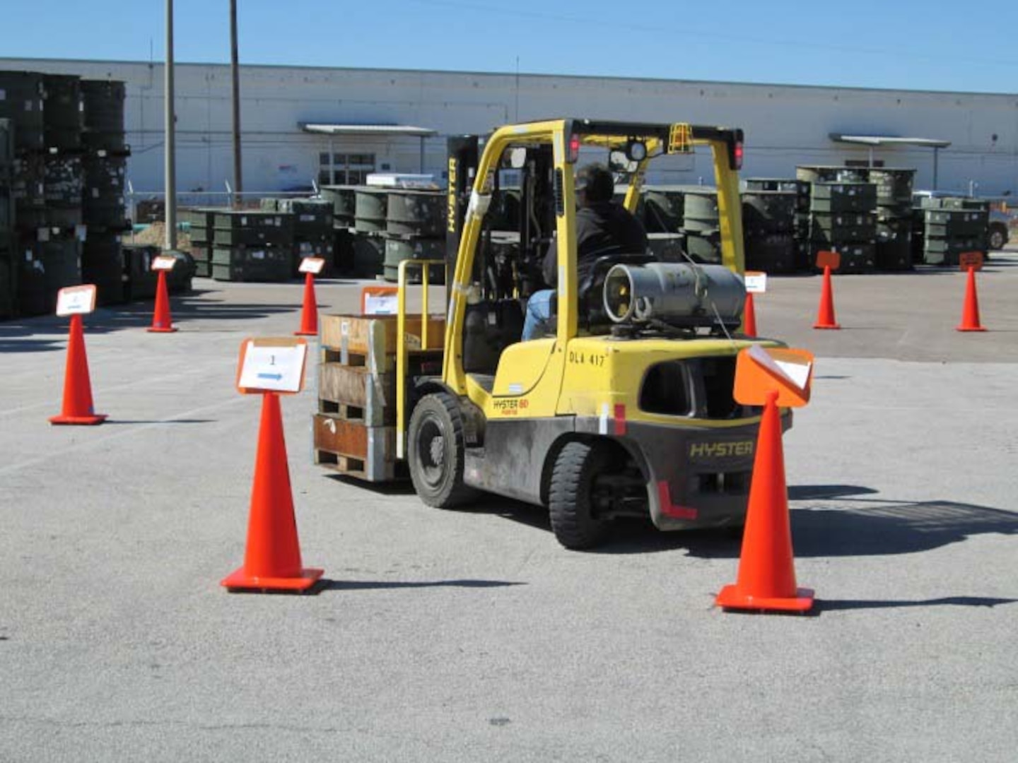 A participant in DLA Distribution Corpus Christi’s Forklift Rodeo navigates a course designed to test their skills.