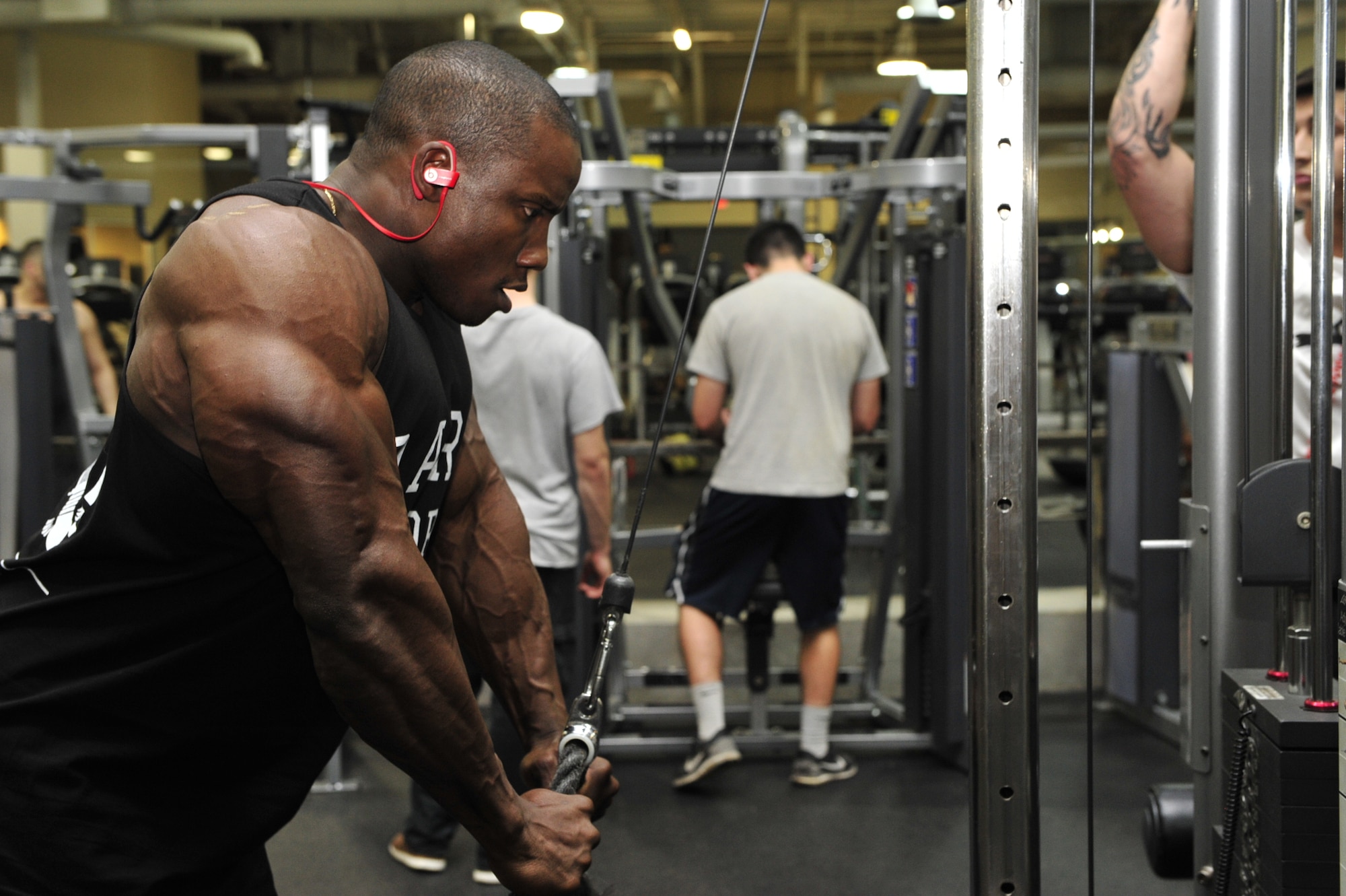 Staff Sgt. Robert Timms, 756th Aircraft Maintenance Squadron weapons lead crew team chief, performs a tricep rope pulldown Feb. 19, 2016 at EOS Fitness in Avondale, Ariz. Timms won first place and overall in Jon Lindsay’s Muscle Contest in the men’s classic physique category January 2016 in Las Vegas. 