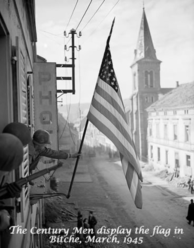 Bitch, France. The 100th Training Division (OS) was originally activated as the 100th Infantry Division during WWII. This iconic photograph was taken after the town of Bitche, France, fell to the 100th Infantry Division, on March 16, 1945. The 100th Infantry Division, during its months of combat in Northeastern France and Western Germany, liberated or captured over 400 towns.  One of these towns was Bitche, and ever since that time they have been known as the “Sons of Bitche.” (Photo and excerpt from archives maintained at the George C. Marshall Foundation)
