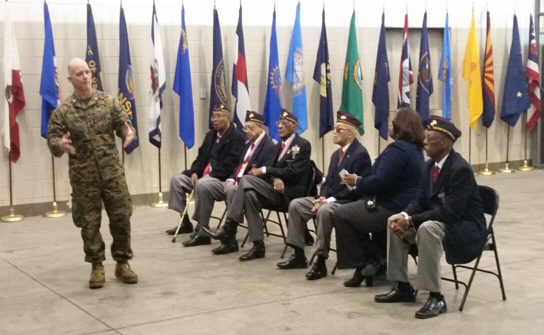 Montford Point Marines listen to Col. John C. Church, Jr., of 3rd Civil Affairs Group, Force Headquarters Group, Marine Forces Reserve, Feb. 6, 2016, as he welcomes them and thanks them for their contributions to the Marine Corps. The Marines of 3rd CAG had the opportunity to listen to the stories of the Montford Point Marines and had the chance to ask them questions. 