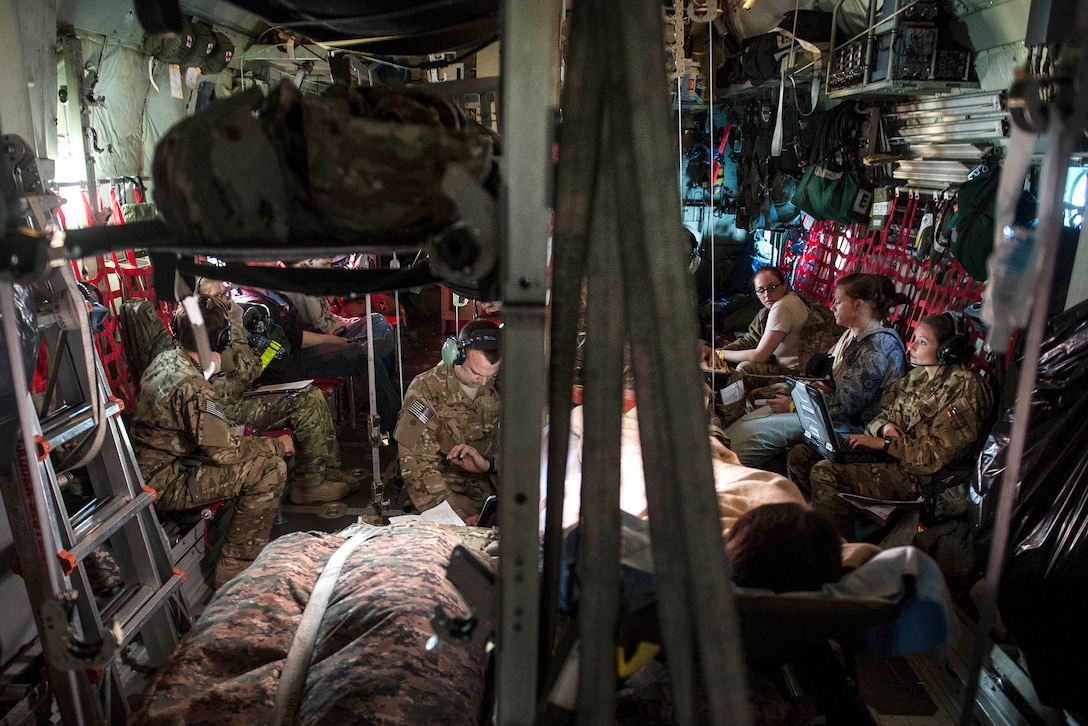 Airmen fly with patients on a C-130 Hercules aircraft participating in an aerial medical evacuation mission on Al Udeid Air Base, Qatar, Feb. 11, 2016. Air Force photo by Staff Sgt. Corey Hook