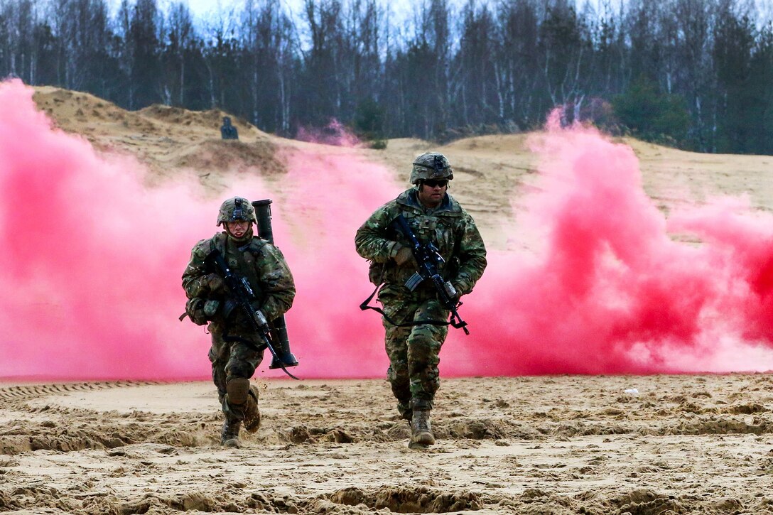 Soldiers advance to their next firing position during a squad live-fire exercise at Gaiziunai Training Area, Lithuania, Feb. 24, 2016. The soldiers are assigned to 3rd Squadron, 2nd Cavalry Regiment. Army photo by Staff Sgt. Michael Behlin