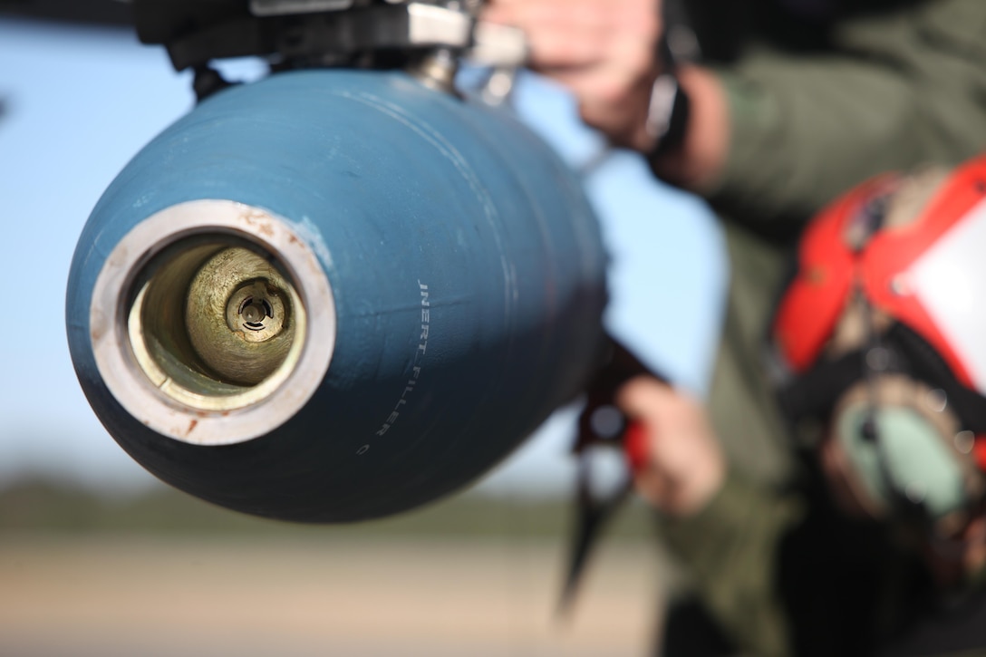 A BDU-45 practice bomb is inspected prior to a takeoff during Exercise Coastal Predator at Marine Corps Air Station Cherry Point, N.C., Feb. 16, 2016. The practice bomb falls according to the trajectory of the aircraft while in flight and is used for training purposes. Coastal Predator is an exercise that included Marine Corps and Army aviation assets along with Air Force personnel and civilian contractors to conduct Forward Air Controller Airborne training in accordance with the pre-deployment training program.  (U.S. Marine Corps photo by Cpl. Jason Jimenez/Released)