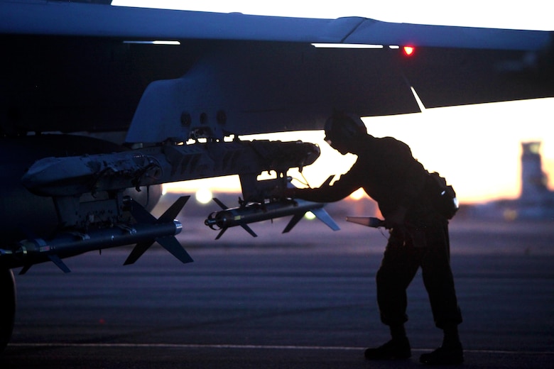 Lance Cpl. Joseph Vazquez conducts final ordnance checks on an F/A-18 Hornet before takeoff during Exercise Coastal Predator at Marine Corps Air Station Cherry Point, N.C., Feb. 16, 2016. Coastal Predator is an exercise that included Marine Corps and Army aviation assets along with Air Force personnel and civilian contractors to conduct Forward Air Controller Airborne training in accordance with the pre-deployment training program. Vazquez is an aircraft ordnance technician with Marine All Weather Fighter Attack Squadron 533. (U.S. Marine Corps photo by Cpl. Jason Jimenez/Released)