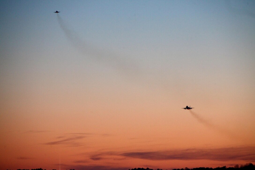 Two F/A-18 Hornets take off during Exercise Coastal Predator at Marine Corps Air Station Cherry Point, N.C., Feb. 16, 2016. Coastal Predator is an exercise that included Marine Corps and Army aviation assets along with Air Force personnel and civilian contractors to conduct Forward Air Controller Airborne training in accordance with the pre-deployment training program. (U.S. Marine Corps photo by Cpl. Jason Jimenez/Released)
