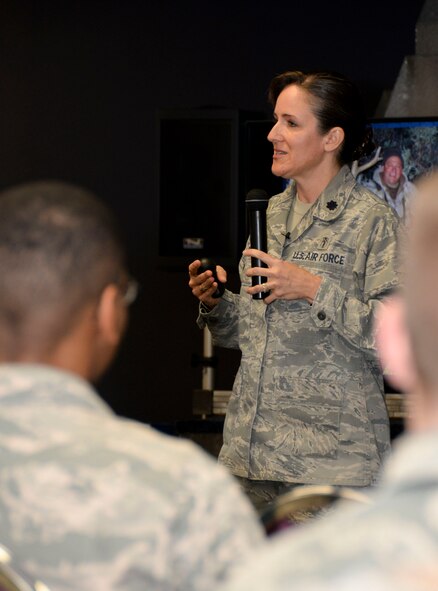 Lt. Col. Teresa Roberts, Profession of Arms Center of Excellence director of operations, engages with Airmen during the Impact of the Human Element Seminar at Barksdale Air Force Base, La., Feb. 16, 2016. The presentation focused on self-reflection and understanding one self and how it applies to other people’s unique perspectives. (U.S. Air Force photo/Senior Airman Amanda Morris)