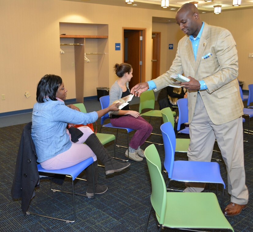 William Downey, the 80th Training Command Sexual Harassment/Assault Response and Prevention Program manager, discusses with advocates affiliated with The Regional Hospital Accompaniment Response Team the services available to military members who end up as sexual assault victims during a meeting at the Glen Allen Library.