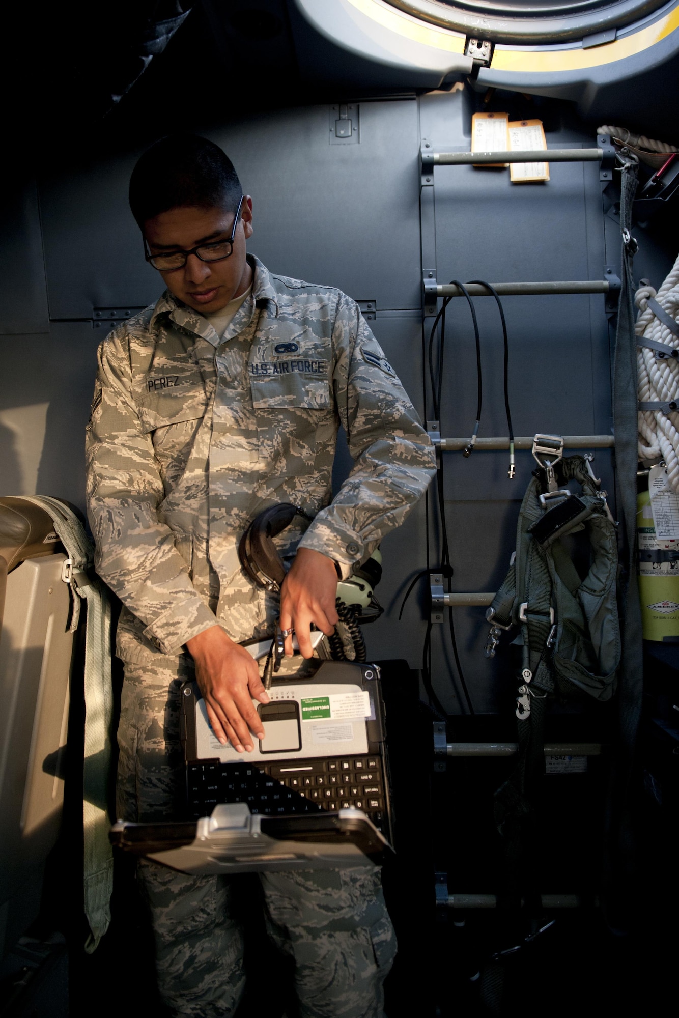 U.S. Air Force Airman 1st Class Yoan Perez, 353rd Special Operations Maintenance Squadron MC-130J Commando II crew chief, performs a final inspection of the aircraft during a training exercise Feb. 17, 2016, at Kadena Air Base, Japan. Perez ensured the aircraft's maintenance checklists were completed and performed final maintenance tasks prior to launch. (U.S. Air Force photo by Senior Airman Peter Reft/Released)