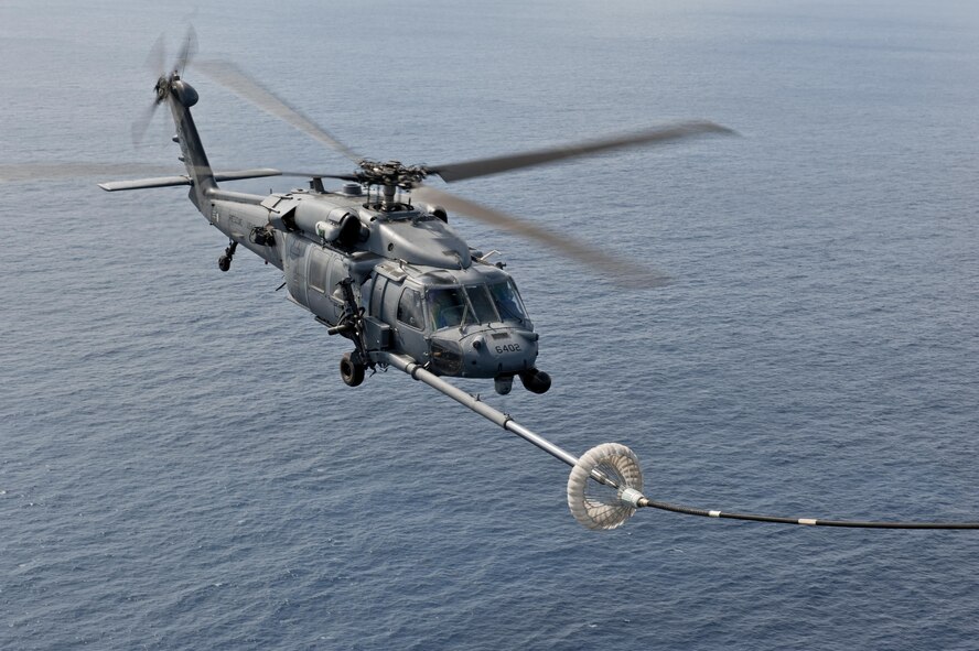 A U.S. Air Force HH-60G Pave Hawk helicopter assigned to the 33rd Rescue Squadron performs in-flight refueling during a training exercise Feb. 17, 2016, off the coast of Okinawa, Japan. The 33rd RS performs military personnel recovery, civil search and rescue, medical evacuation, disaster response, and humanitarian assistance. (U.S. Air Force photo by Senior Airman Peter Reft/Released)