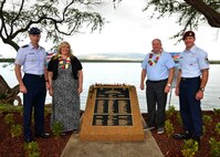 Maj. Gen. Kevin Schneider, Headquarters Pacific Air Forces chief of staff, Traci Megenney, Chef Master Sgt. Richard Etchberger’s granddaughter, Cory Etchberger, Chief Master Sgt. Richard Etchberger’s son, and Chief Master Sgt. Michael Atkins, Headquarters Pacific Air Forces pararescue functional area manager, attended the Congressional Medal of Honor Memorial Rededication Ceremony at Aloha Ania Park on Joint Base Pearl Harbor-Hickam, Hawaii, Feb. 19, 2016. Base officials rededicated the Medal of Honor Monument at JBPHH to recognized Medal of Honor recipients, Chief Master Sgt. Richard Etchberger and Airman 1st Class William Pitsenbarger. (U.S. Air Force photo by Tech. Sgt. Aaron Oelrich/Released)