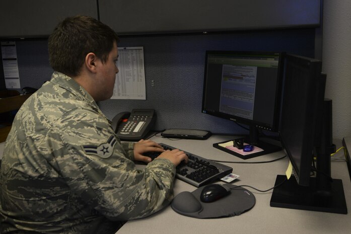 Airman 1st Class Jonathan Camelo, 99th Force Support Squadron force management journeyman, looks over an evaluation performance report at Nellis Air Force Base, Nev., Feb. 22, 2016. The Air Force is on year 2 of the 3 year rollout of the most substantial changes in how we are evaluated and promoted since 1970. 