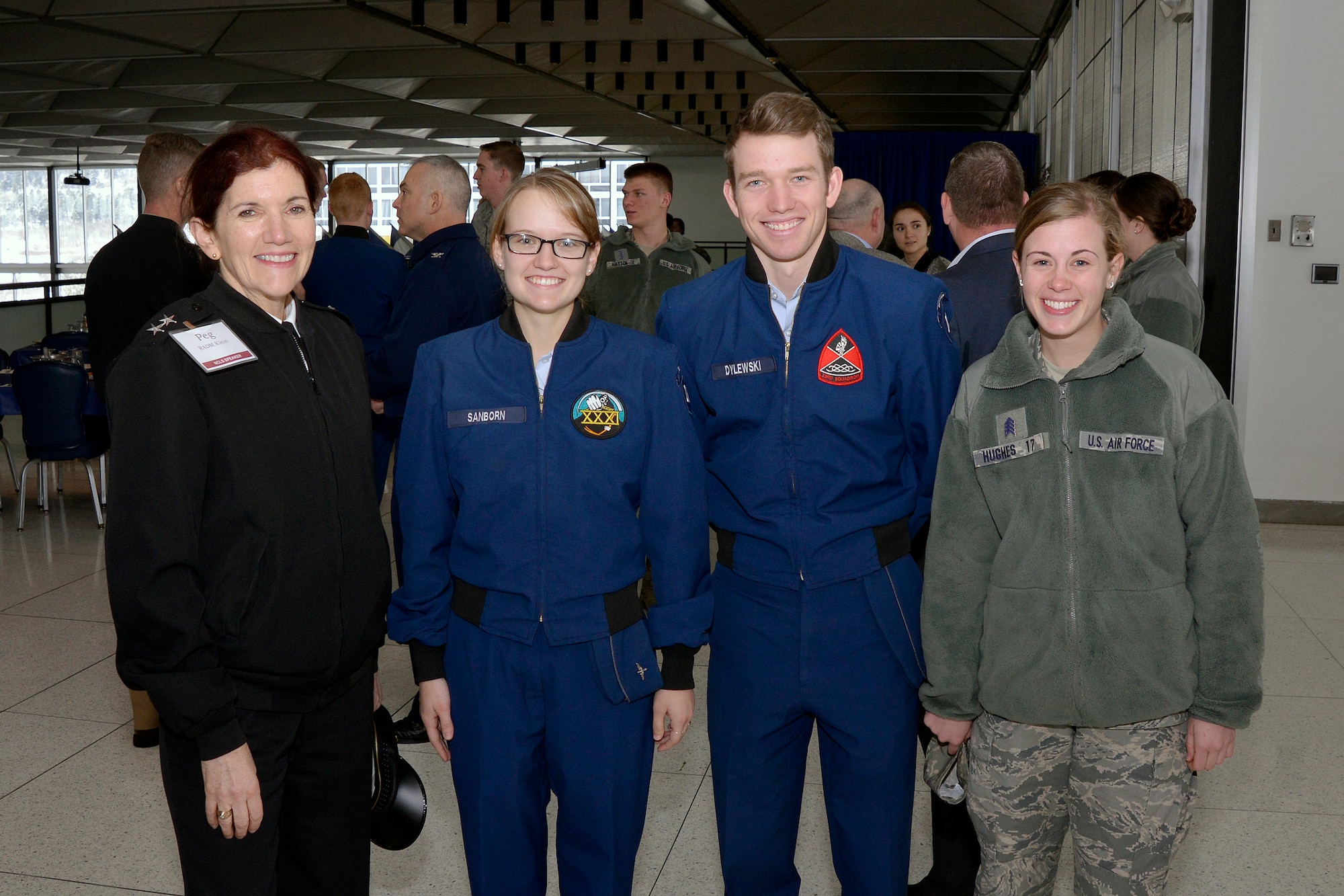Rear Adm. Margaret Klein, the Defense Department's senior advisor for Military Professionalism, stands with three cadets at the U.S. Air Force Academy, Feb. 23, 2016. Klein visited the Academy to introduce the DOD's inaugural Professionalism Summit hosted by the Academy, Feb. 23-24. (U.S. Air Force photo/Jason Gutierrez)