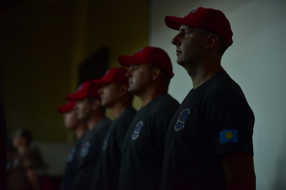U.S. Air Force Capt. Jeffrey Jarvis, a physician's assistant deployed from the 18th Medical Group at Kadena Air Base, Japan, stands at attention during a change-of-charge ceremony, held Feb. 19, 2016, at the Ngarachamayong Cultural Center, located in Palau’s Koror state.  Airmen of CAT 554-01 provided construction capabilities, apprenticeship training, medical outreach, and community engagement opportunities while deployed to the Republic of Palau. (U.S. Air Force photo by Staff Sgt. Christopher Stoltz/Released)