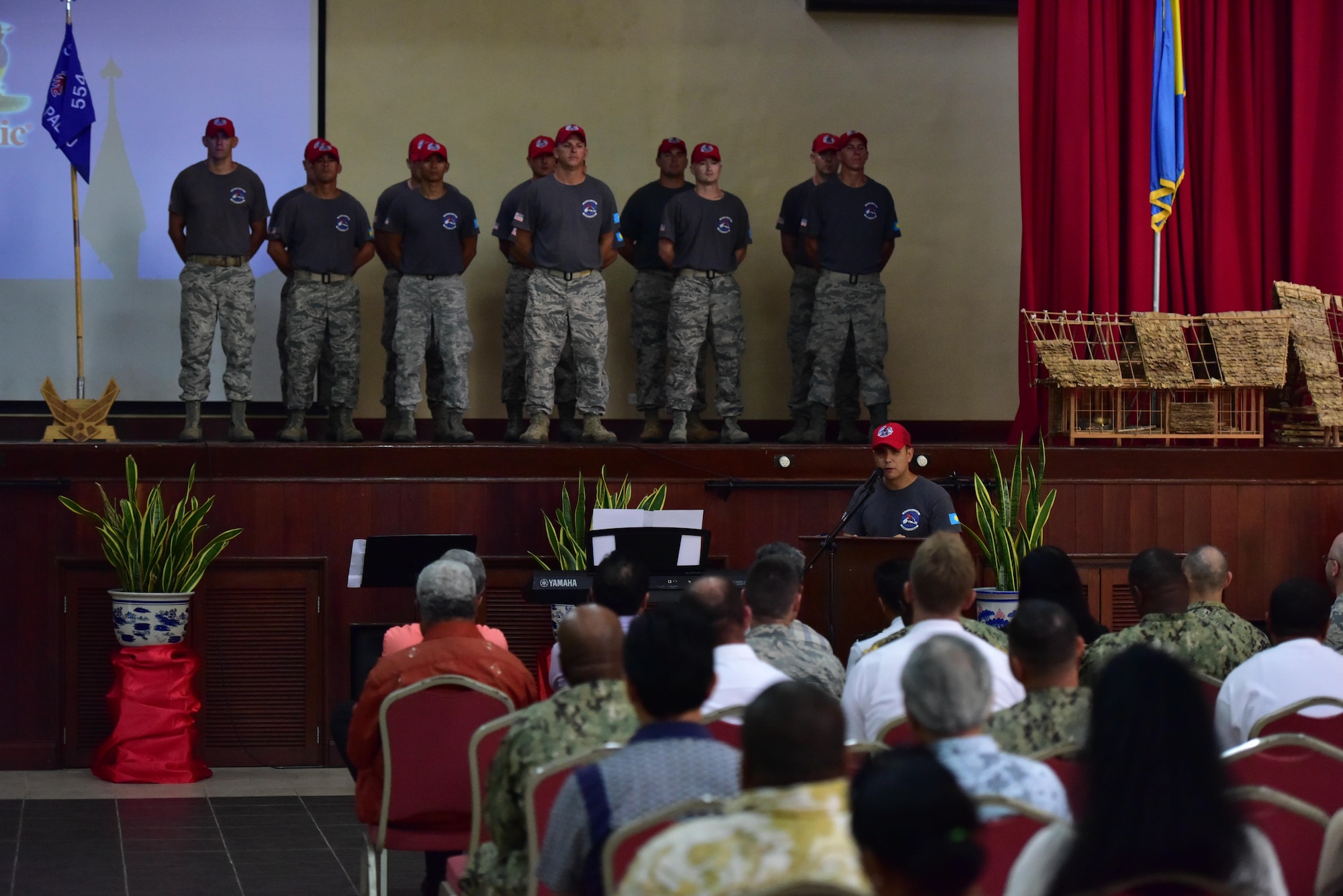 United States Air Force Capt. Naseem Ghandour, Civil Action Team 554-01 officer in charge and engineering flight deputy commander from the 554th RED HORSE Squadron from Andersen Air Force Base, Guam, speaks during a change of charge ceremony, held Feb. 19, 2016, at the Ngarachamayong Cultural Center, located in Palau’s Koror state. Airmen of CAT 554-01 provided construction capabilities, apprenticeship training, medical outreach and community engagement opportunities while deployed to the Republic of Palau. (U.S. Air Force photo by Staff Sgt. Christopher Stoltz/Released)