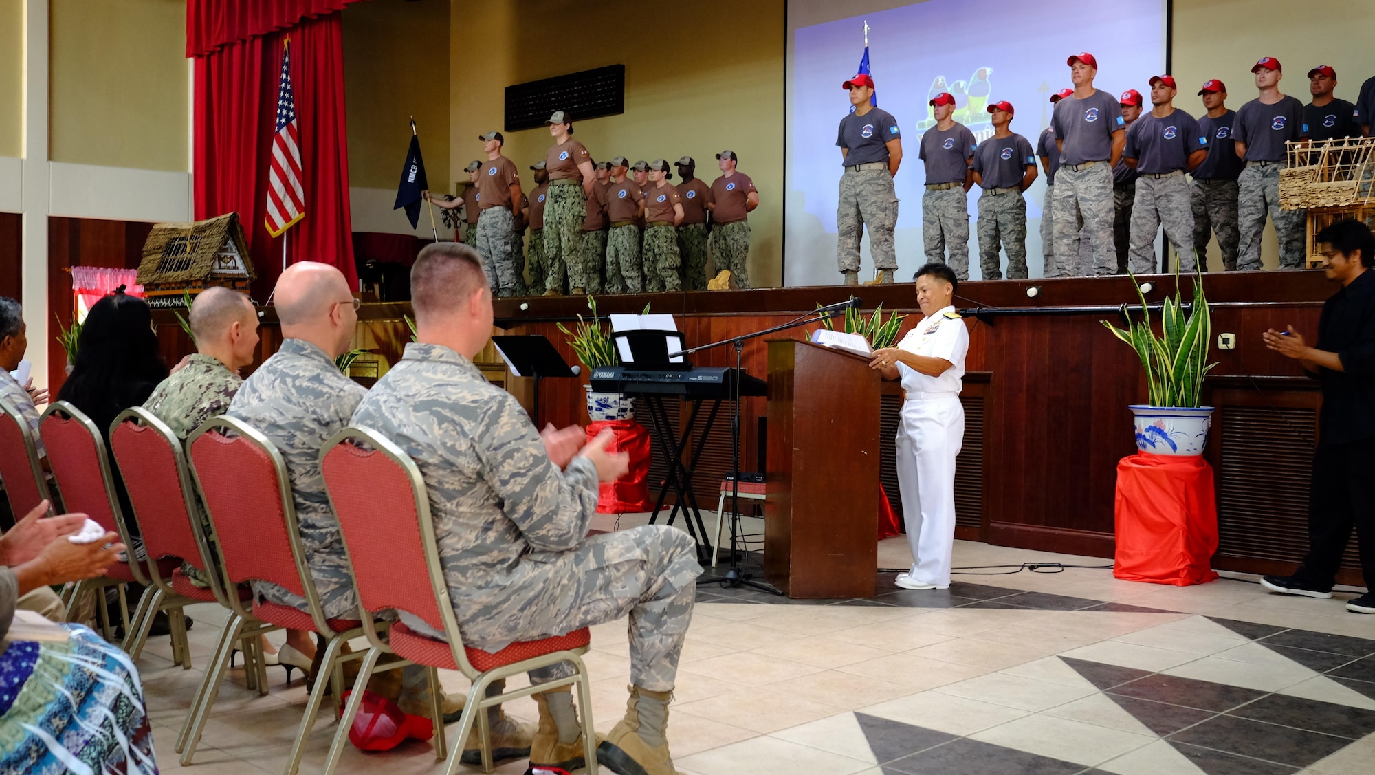 U.S. Navy Rear Adm. Bette Bolivar, Joint Region Marianas commander, speaks during a change of charge ceremony, held Feb. 19, 2016, at the Ngarachamayong Cultural Center, located in Palau’s Koror state. Airmen of CAT 554-01 provided construction capabilities, apprenticeship training, medical outreach and community engagement opportunities while deployed to the Republic of Palau. (U.S. Air Force photo by Staff Sgt. Christopher Stoltz/Released)