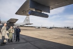 Lt. Col. Matthew "Banger" Baugher, from the Air National Guard Air Force Reserve Test Center (AATC), explains the LITENING pod targeting system to Maj. Gen. Mark H. Berry, the adjutant general of Arkansas, right, and Brig. Gen. Kurt Vogel, the commander of the Arkansas Air National Guard. The 189th Airlift Wing C-130s have been tapped as test beds for a highly-accurate air drop and reconnaissance system.