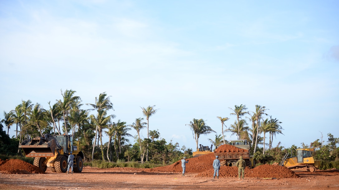 Airmen from the Royal Australian Air Force, Republic of Singapore Air Force, Republic of Korea Air Force and the Japan Air Self Defense Force construct berms and dikes during Partner Nation Silver Flag Feb. 19, 2016, at Andersen Air Force Base, Guam. The event was the first time partner nations were presented the opportunity to travel to Guam to trade engineering practices with each other and the U.S. Air Force. (U.S. Air Force photo by Senior Airman Joshua Smoot/Released)