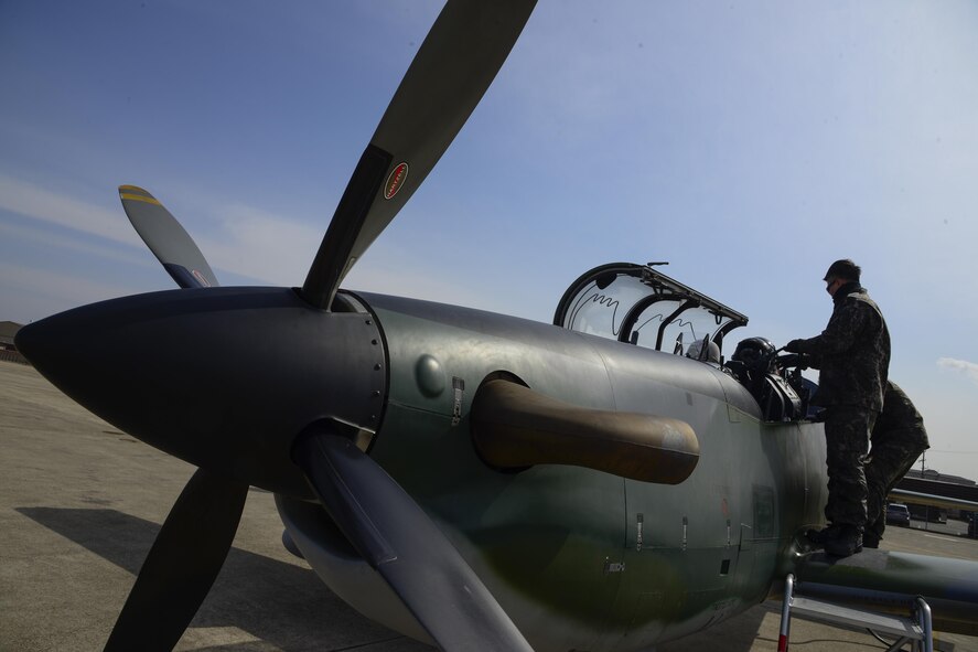 South Korean air force crew chiefs from the 237th Fighter Squadron conduct a preflight inspection on the KA-1 Woongbi during Buddy Wing 16-2 on Osan Air Base, South Korea, Feb. 23, 2016. Buddy Wing 16-2 is the second in a series of joint training, combat exercises to be conducted this year across the peninsula. The exercises strengthen the South Korean and U.S. alliance. (U.S. Air Force photo/Senior Airman Kristin High)