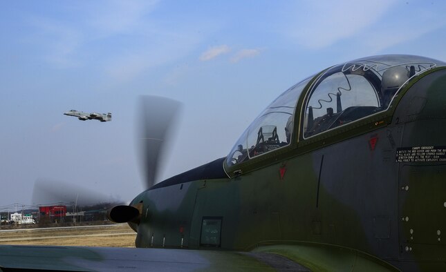 Pilots from Republic of Korea air force, 237th Fighter Squadron, Wonju Air Base, watch an A-10 Thunderbolt II, 25th FS, take off during Buddy Wing 16-2 on Osan Air Base, ROK, Feb. 23, 2016. Buddy Wing 16-2 is the second in a series of joint training, combat exercises to be conducted this year across the peninsula, utilized to strengthen the ROK/U.S. alliance. (U.S. Air Force photo by Senior Airman Kristin High/Released)