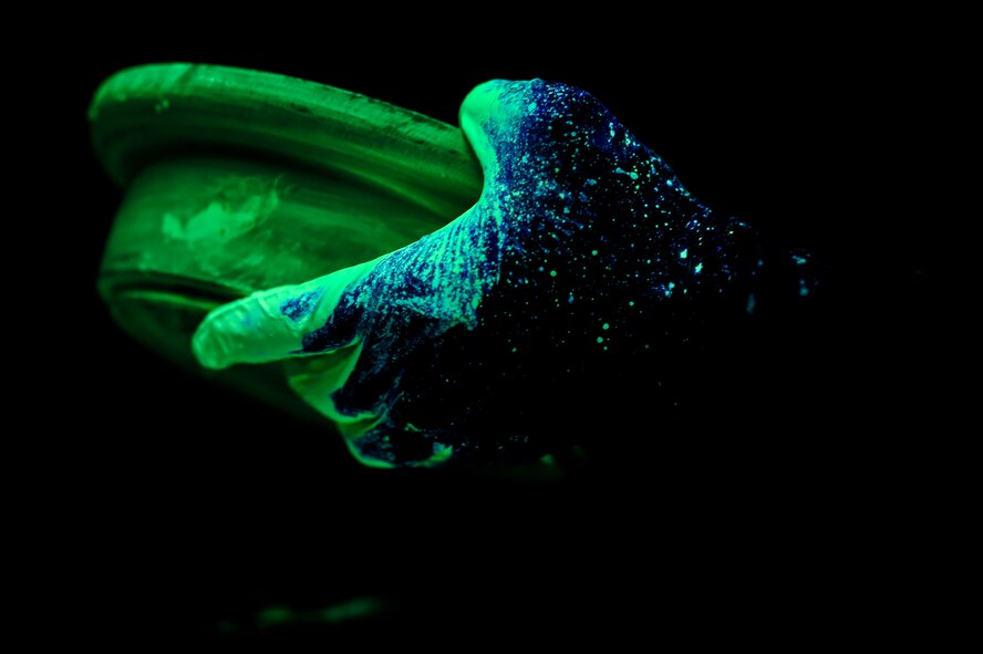 Airman 1st Class David Frias, a 49th Maintenance Squadron non-destructive inspection technician, inspects a metal part for damage at Holloman Air Force Base, N.M. on Feb. 22. Frias used a low-viscosity penetrant, which fills any voids left by cracks or damage, and indicates a need for repair. After the penetrant is applied, it creates a visible indication of damage. The NDI technicians are able to assist aircraft maintainers by identifying even the smallest amount of damage to aircraft parts in a non-destructive manner, allowing them to ensure military aviation equipment safety. (U.S. Air Force photo by Senior Airman Leah Ferrante) 