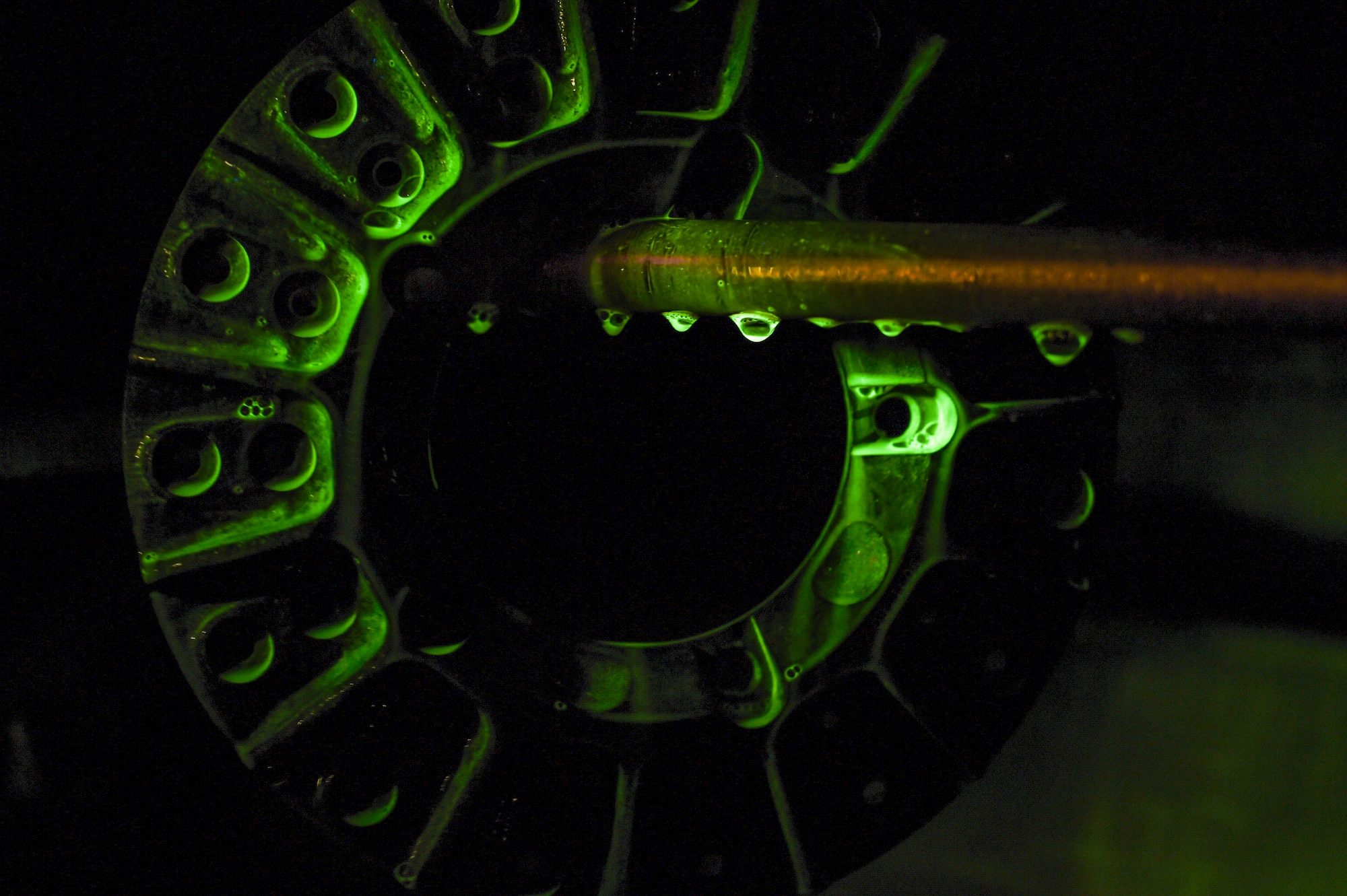 A metal training part sits in a magnetized machine at Holloman Air Force Base, N.M. on Feb. 22. The machine pulls magnetic particles to areas of the part that are damaged The 49th Maintenance Squadron non-destructive inspection shop provides mission-essential services by inspecting various aircraft parts for damage or corrosion, allowing them to ensure military aviation equipment safety. (U.S. Air Force photo by Senior Airman Leah Ferrante)