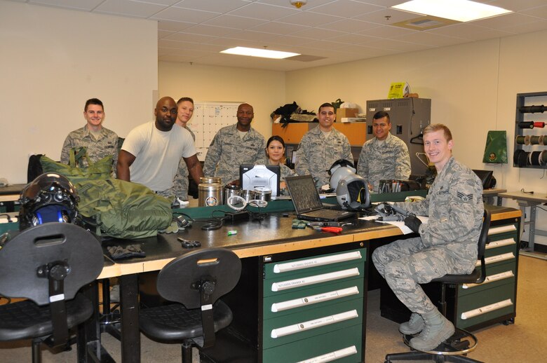 (Center) Master Sgt. Kevin Younger, pictured with the team here Feb. 22, credits the 422nd Test and Evaluation Squadron Aircrew Flight Equipment shop with earning the Air Force-level award. The team is composed of Regular Air Force members and full-time integrated reservists who employ the F-35 Automated Logistics Integrated System to test AFE equipment. Younger has been integrated into the RegAF unit since 2008. (U.S. Air Force photo)