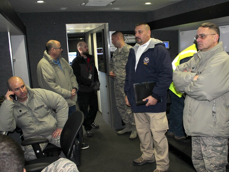 Michigan Air National Guard personnel from the 127th Wing and officials of the Federal Emergency Management Agency work in the Mobile Emergency Operations Center at Selfridge Air National Guard Base, Jan. 21, 2016. The Federal Emergency Management Agency and the Michigan National Guard are working closely together, along with other city and state agencies, to supply bottled water and water filters to resident of Flint, Mich., due to concerns about the safety of the water in that city. (U.S. Air National Guard photo by Tech. Sgt. Dan Heaton)