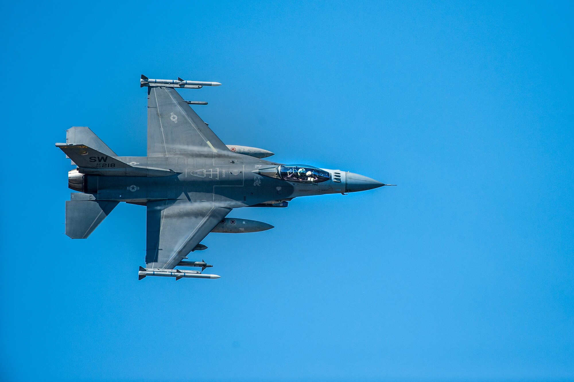 An F-16 Fighting Falcon performs a show-of-force maneuver during a training exercise, Feb. 18, 2016, at Moody Air Force Base, Ga. Multiple U.S. Air Force aircraft within Air Combat Command conducted joint aerial training at Grand Bay Bombing and Gunnery Range. During the training, the aircraft conducted tactical air and ground maneuvers, as well as weapons training. (U.S. Air Force photo by Airman 1st Class Lauren M. Johnson/Released)